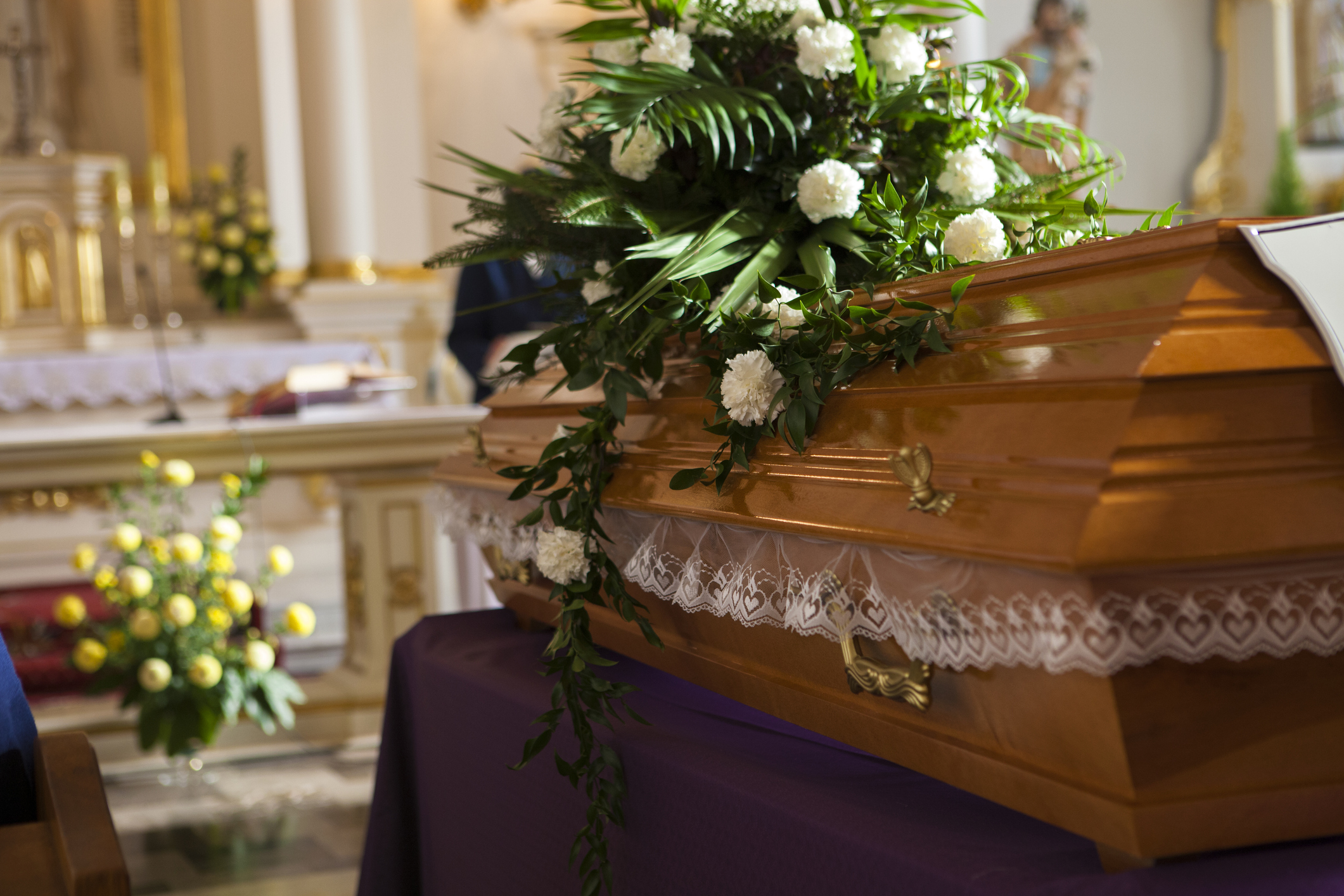 Flowers on a coffin in the church